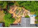An aerial view of a backyard showcasing a large garden area and outdoor seating space at 1158 Shoreside Way, Mount Pleasant, SC 29464