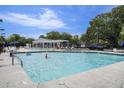Community pool with lounge chairs and a gazebo, offering a perfect spot for relaxation and social gatherings at 1250 Wide Water Ct, Charleston, SC 29412