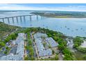Aerial view of luxurious apartments nestled along the waterfront with views of the bridge at 130 River Landing Dr # 3202, Charleston, SC 29492
