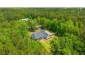 Aerial view of a house surrounded by a dense, green forest, creating a private retreat at 1375 Tannanger Trl, Awendaw, SC 29429