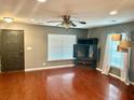 A modern living room featuring hardwood floors, a ceiling fan, recessed lighting, and large window at 1401 Dabbling Duck Dr, Summerville, SC 29483