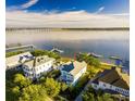 Stunning aerial view of waterfront home with private dock, situated on a picturesque river at 1410 Smythe St, Charleston, SC 29492