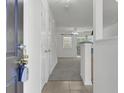 Bright entryway with tile floor leading to carpeted living area, showcasing open concept at 302 Elm Hall Cir, Summerville, SC 29483