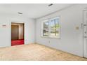 Bright living room features a large window, neutral carpet, and a view to the entry way at 3249 Stonehaven Dr, North Charleston, SC 29420