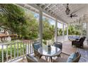 Inviting outdoor porch featuring comfortable seating with views of lush gardens and mature trees at 3305 Knot Aly, Johns Island, SC 29455