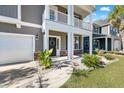 Inviting front entrance with a two-story porch and a well-maintained garden at 342 Saxony Loop, Summerville, SC 29486