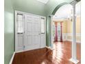 Inviting entryway features hardwood floors and a classic archway leading to another room at 5404 Red Fork Ln, North Charleston, SC 29420