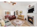 Open-concept living room boasts a fireplace and access to other living areas at 541 Brick Barn Ln, Goose Creek, SC 29445