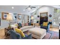 Open-concept living area featuring a fireplace, hardwood floors, and comfortable seating arrangements at 638 Stono Edge Dr, Charleston, SC 29412