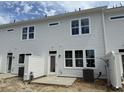 Back of the home with backyard patio and door leading into the home at 760 Blueway Ave, Summerville, SC 29486