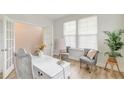 Bright home office with french doors, natural light, a writing desk, and cozy chairs at 802 S Pointe Blvd, Summerville, SC 29483