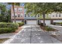 Charming townhome exteriors with colorful facades, garages, and mature landscaping for curb appeal at 9019 Parlor Dr, Ladson, SC 29456