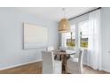 Cozy dining area with bright windows and a modern woven pendant light at 104 Snow St, Summerville, SC 29486