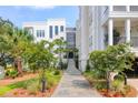 Inviting front entrance with landscaped walkway and staircase to building at 108 Fairbanks Oak Aly # 201, Charleston, SC 29492