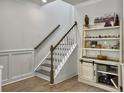 Elegant staircase with white railing and stylish decor for a touch of sophistication at 115 Daniels Creek Cir, Goose Creek, SC 29445