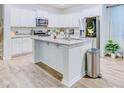 Bright kitchen with a large island, stainless steel appliances, and granite countertops at 120 Loon Dr, Summerville, SC 29483