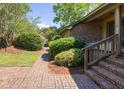 Inviting front entrance with brick walkway, mature landscaping, and charming home facade at 1218 Chersonese Round, Mount Pleasant, SC 29464