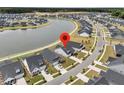 Aerial view of the neighborhood shows the community lake and the home's location at 1273 Locals St, Summerville, SC 29485