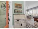 Bright foyer with decorative furniture, open to dining area, creating a welcoming and airy atmosphere at 1348 Seaside Plantation Dr, Charleston, SC 29412