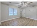 Inviting living room with new floors, a ceiling fan, and a bright window illuminating the neutral interior at 141 Larson Dr, Summerville, SC 29485