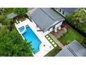 Aerial view of a private backyard with a pool, patio, and beautifully landscaped gardens at 2792 River Vista Way, Mount Pleasant, SC 29466