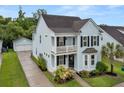 Attractive two-story home boasts a double porch, well-maintained landscaping, and detached garage at 2881 Rutherford Way, Charleston, SC 29414