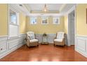 Bright living room with hardwood floors, decorative trim, and ample natural light at 2881 Rutherford Way, Charleston, SC 29414