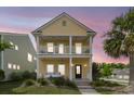 Attractive two-story home featuring a porch swing and double balconies, perfect for enjoying scenic views at 2961 Waterleaf Rd, Johns Island, SC 29455