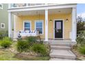 Welcoming front porch featuring a cozy porch swing and a well-manicured garden leading to the entrance at 2961 Waterleaf Rd, Johns Island, SC 29455