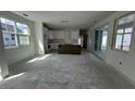 Bright living room and kitchen area with sliding glass doors to the backyard at 333 Trailmore Ln, Summerville, SC 29486