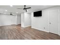 Spacious living room boasts modern ceiling fans and stylish wood-look flooring throughout at 40 Elmwood Pl, Goose Creek, SC 29445