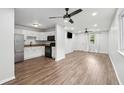Open-concept living room and kitchen with stainless steel appliances and stylish finishes at 40 Elmwood Pl, Goose Creek, SC 29445