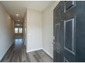 Inviting foyer with wood-look flooring and a view into the adjacent living spaces at 430 Pender Woods Dr, Summerville, SC 29486