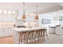 Gourmet kitchen boasts a large center island with seating, modern lighting, and stainless steel appliances at 477 Yellow House Pl, Charleston, SC 29492
