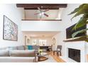 Bright living room featuring a soaring ceiling, fireplace, open dining area, and comfortable seating at 554 Double Eagle Trce, Seabrook Island, SC 29455