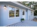 Inviting porch with gray floors and charming details offering a cozy spot to enjoy views at 555 Double Eagle, Seabrook Island, SC 29455