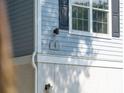 Close-up detail of house number against the gray siding with a black window shutter at 60 Fenwick Hall Allee # 432, Johns Island, SC 29455