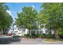 The complex shows mature trees, accessible parking, and lovely landscaping at 60 Fenwick Hall Allee # 432, Johns Island, SC 29455