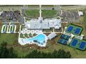 Overhead shot of community clubhouse, pool, tennis courts, parking, and landscaping at 717 Blue Iris Way, Summerville, SC 29486