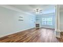 Inviting living room with hardwood floors, fireplace, light-blue walls, and large windows creating a cozy and bright atmosphere at 1025 Riverland Woods Pl # 904, Charleston, SC 29412
