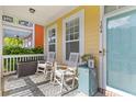 Inviting front porch with rocking chairs, a patterned rug, and a view of the charming neighborhood at 104 Hyacinth St, Summerville, SC 29483