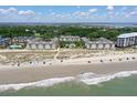 Stunning aerial view shows easy beach access, refreshing pool, and lush grounds at 9000 Palmetto Dr # C104, Isle of Palms, SC 29451