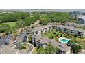 An aerial view of the building complex with parking and well-maintained landscape at 9000 Palmetto Dr # C104, Isle of Palms, SC 29451