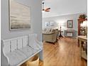 Welcoming entryway with bench seating leading into a cozy living area with hardwood floors at 1048 Wayfarer Ln, Charleston, SC 29412