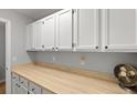 Functional laundry room with ample cabinet space and a neutral countertop at 1048 Wayfarer Ln, Charleston, SC 29412