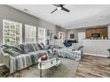 Comfortable living room with a ceiling fan and natural light from the many bright windows at 113 Southernwood Dr, Ladson, SC 29456