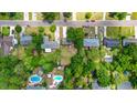Aerial view of neighborhood featuring lush greenery, mature trees, homes and swimming pools at 117 Canaberry Cir, Summerville, SC 29483