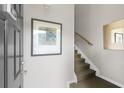 Entryway with stairs, modern wall art and neutral paint, creating a bright and inviting space at 1225 Blakeway St # 407, Charleston, SC 29492