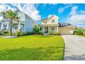 Beautiful home with a lush green lawn, inviting front porch, and convenient attached garage, set in a friendly neighborhood at 1545 Calaveras Cir, Mount Pleasant, SC 29466
