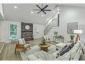 Cozy living room showcases a brick fireplace, comfortable seating, and an inviting atmosphere at 169 Southwold Cir, Goose Creek, SC 29445